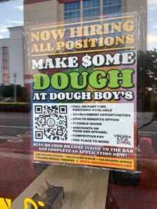 regular ‘Now Hiring’ signs posted across retail stores screaming for workers 2